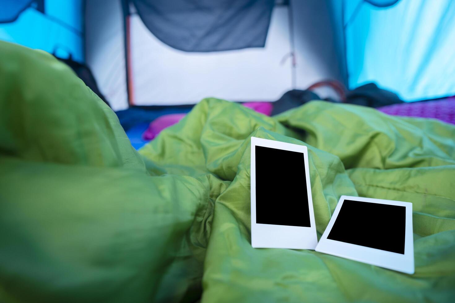 Two polaroids were placed on a sleeping bag in the tent, To record the memories of the trip photo