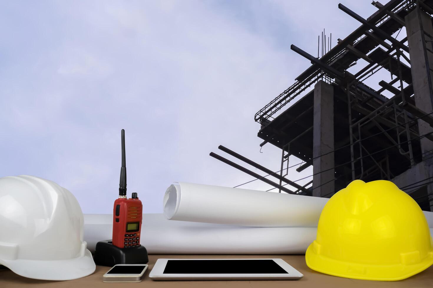helmet in construction site and construction site worker background safety first concept photo