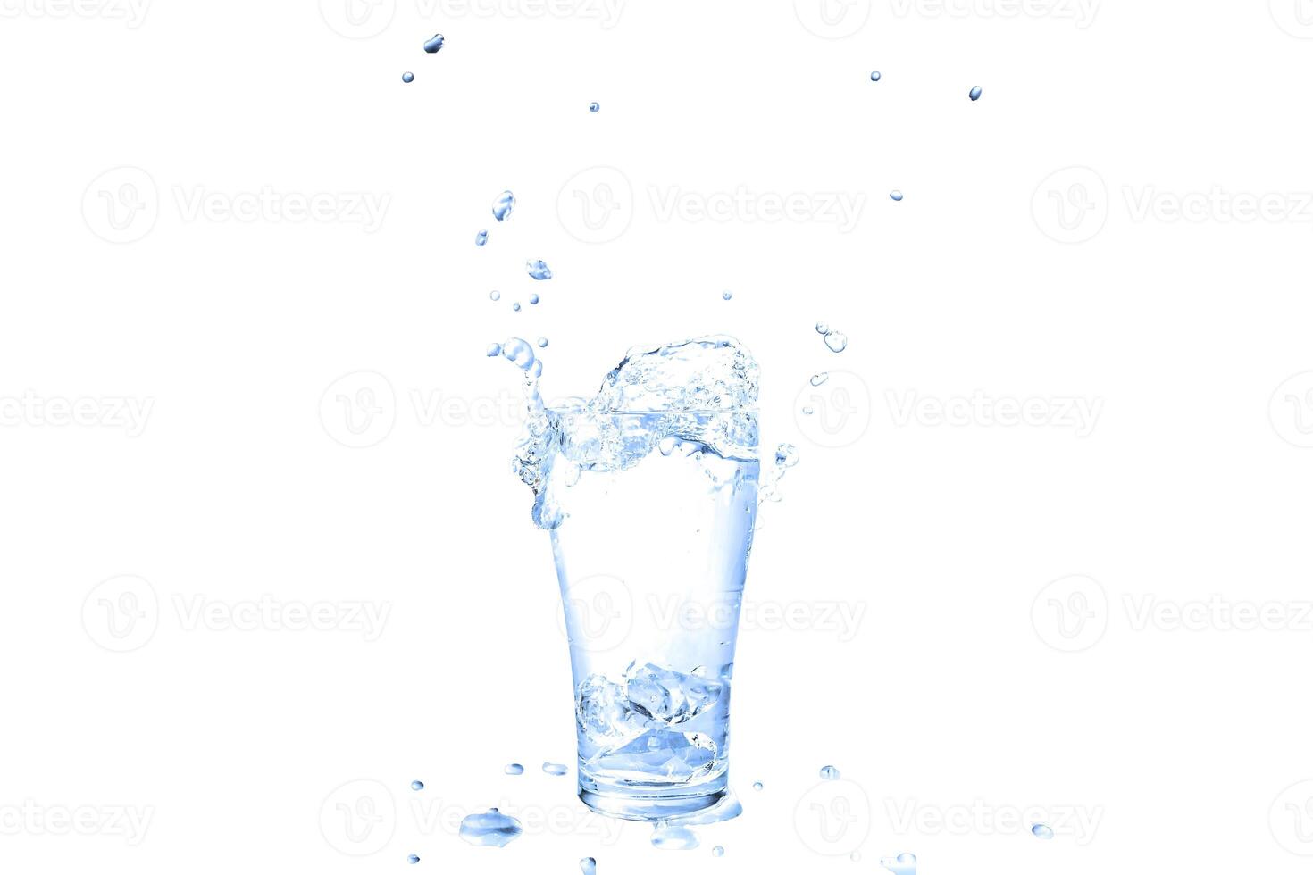 Ice cubes splashing into glass of water. photo