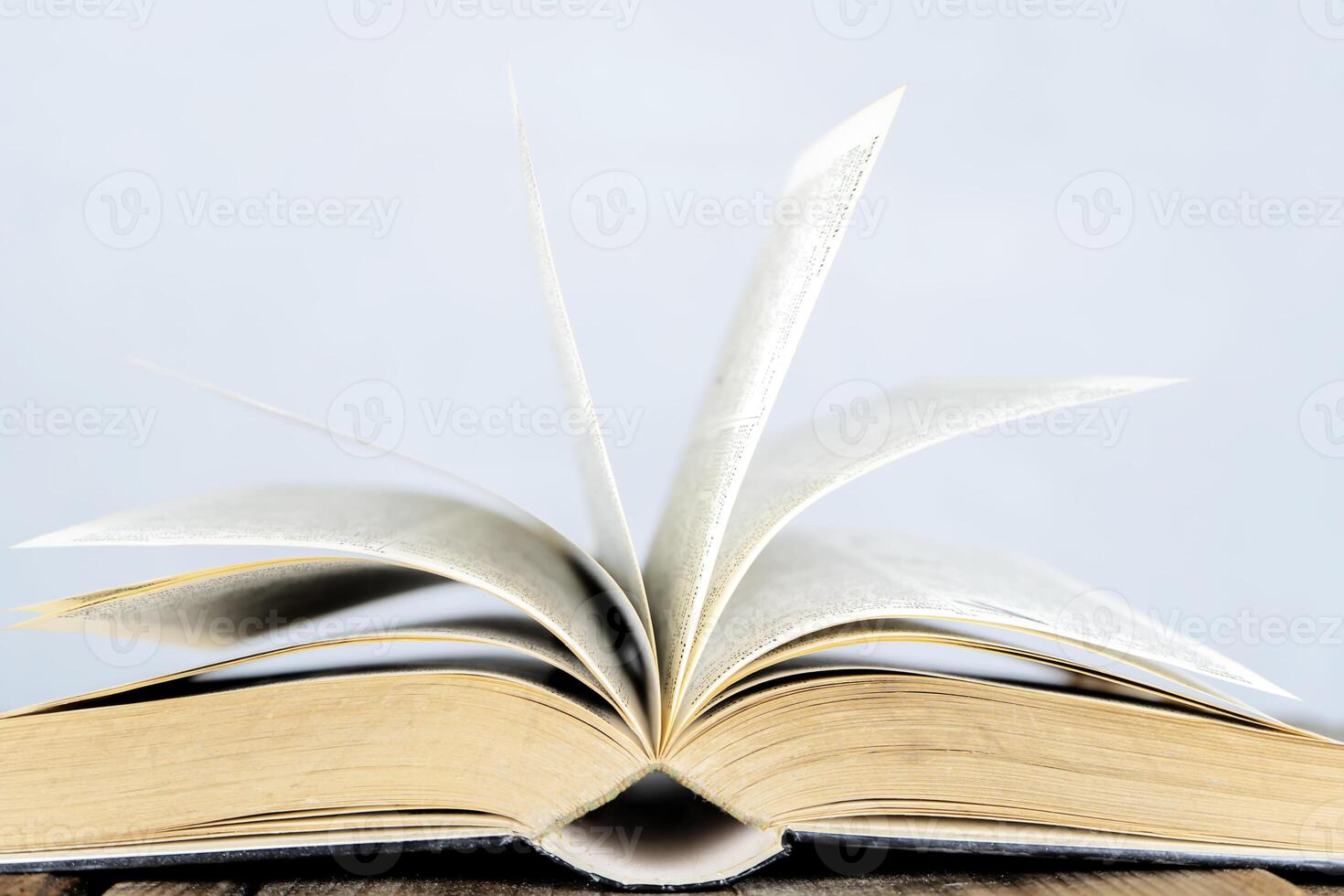 For educational success. Books that are open, paper looks moving. photo