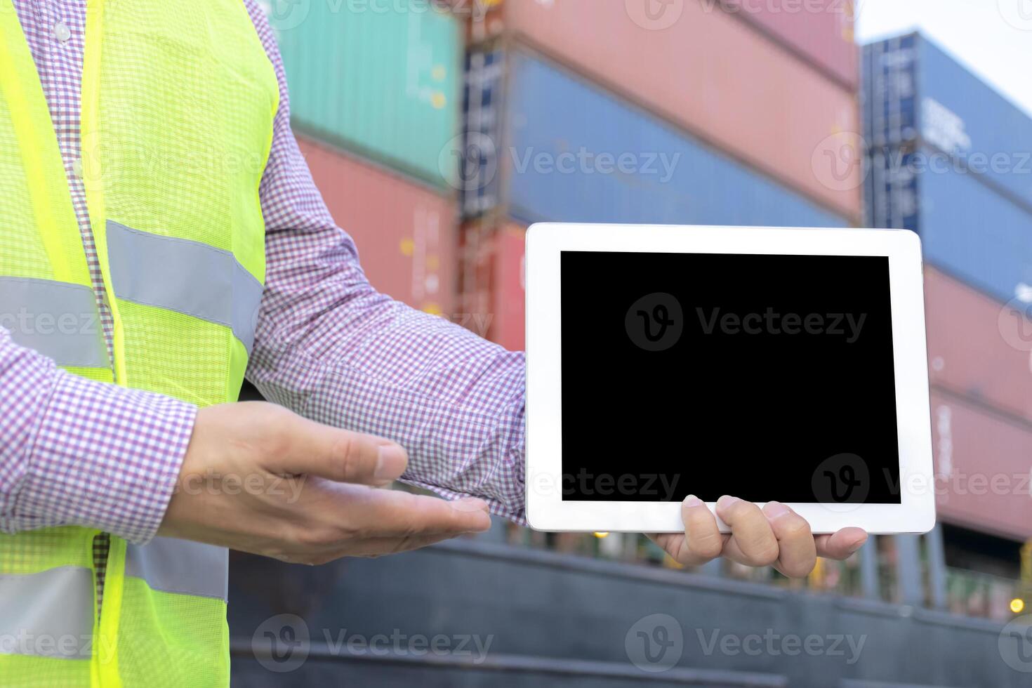 Logistic concept. Engineering is holding a tablet. photo