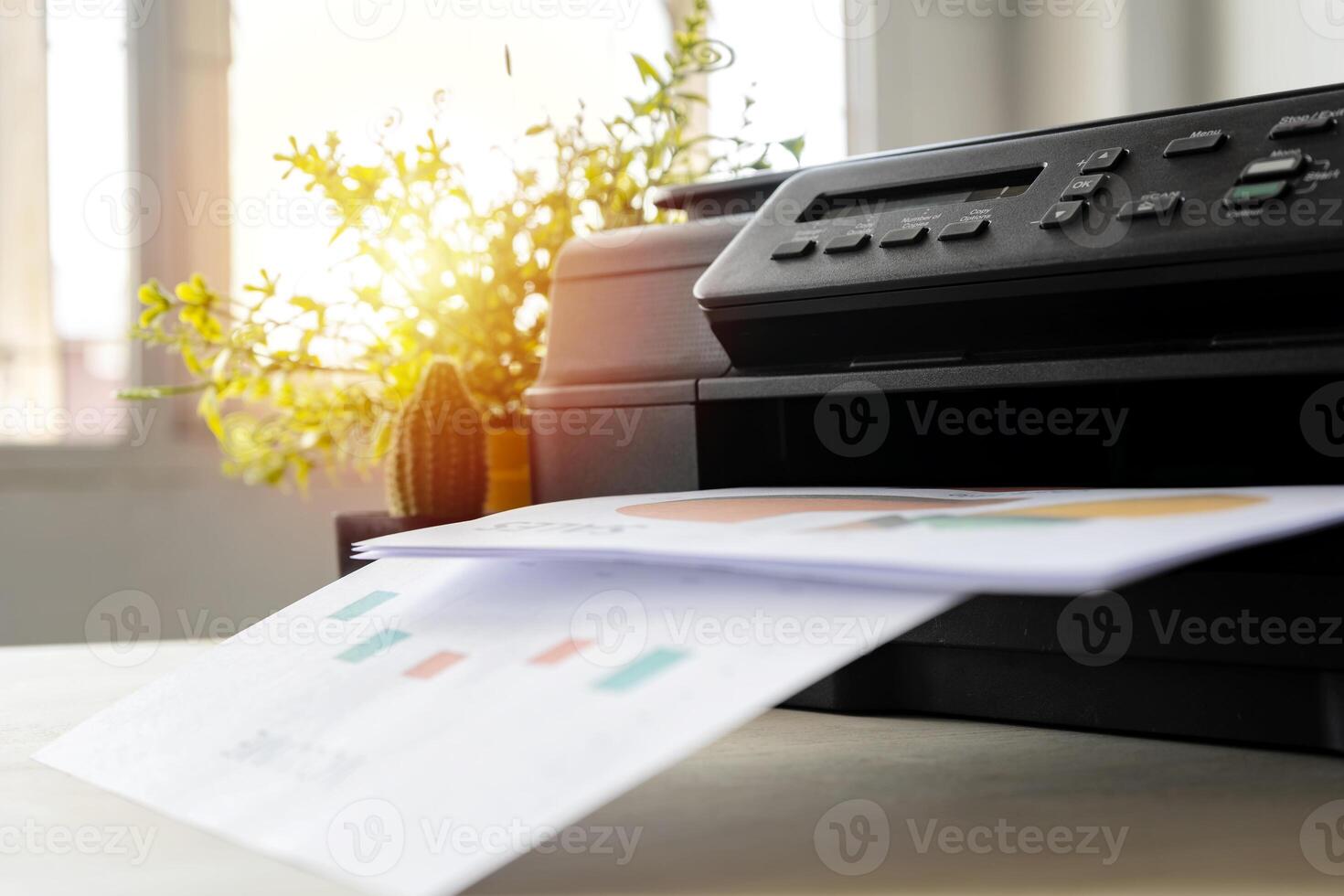 The printer is fully functional,Located on the desk. photo