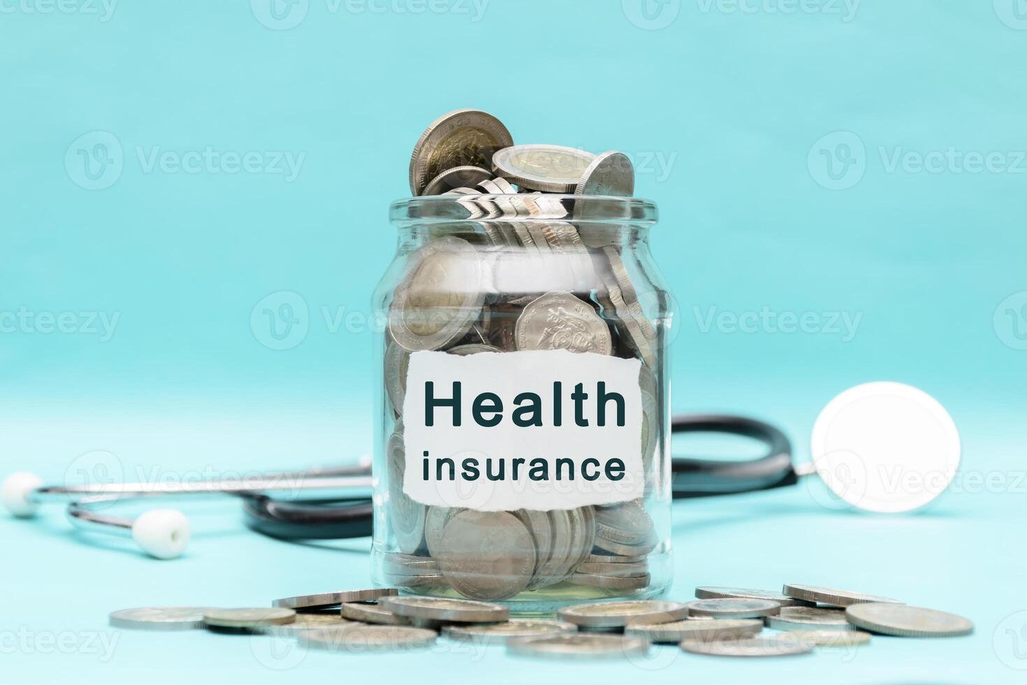Glass jar containing coins until overflowing, health insurance. photo