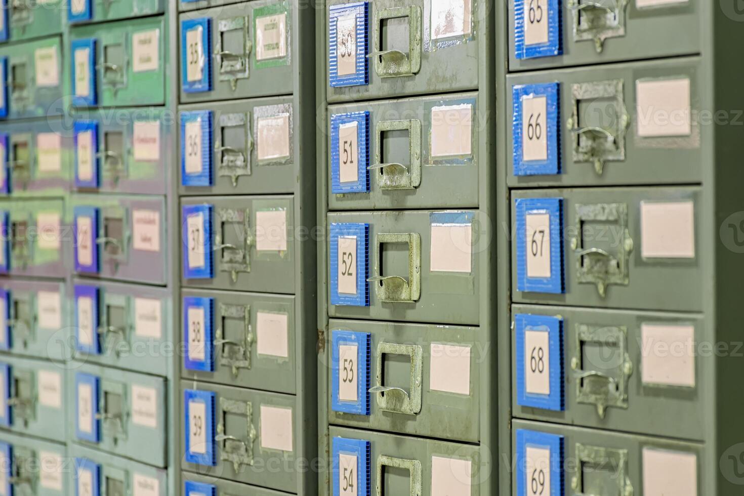 Filing cabinet is steel. Used for document storage. It is very active and long time to old. photo
