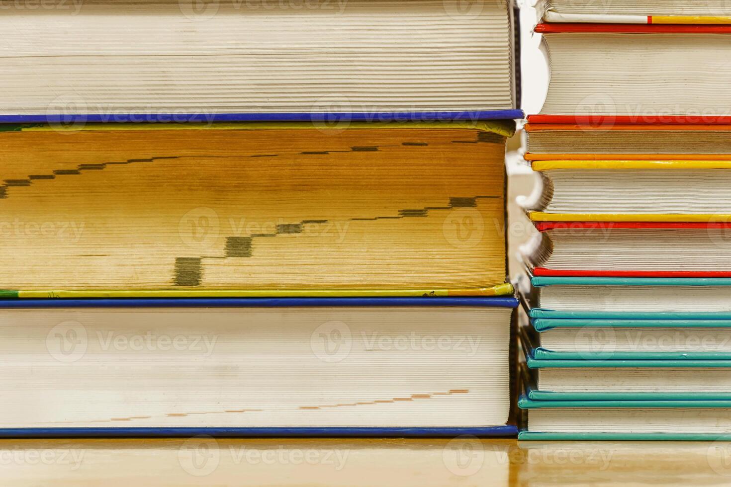 Stacked books have a variety of Vintage colors. photo