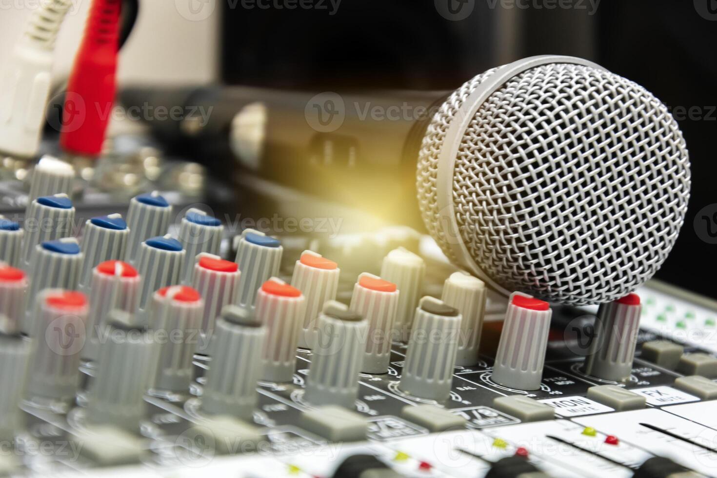 Stage control.Hand adjusting audio mixer. photo
