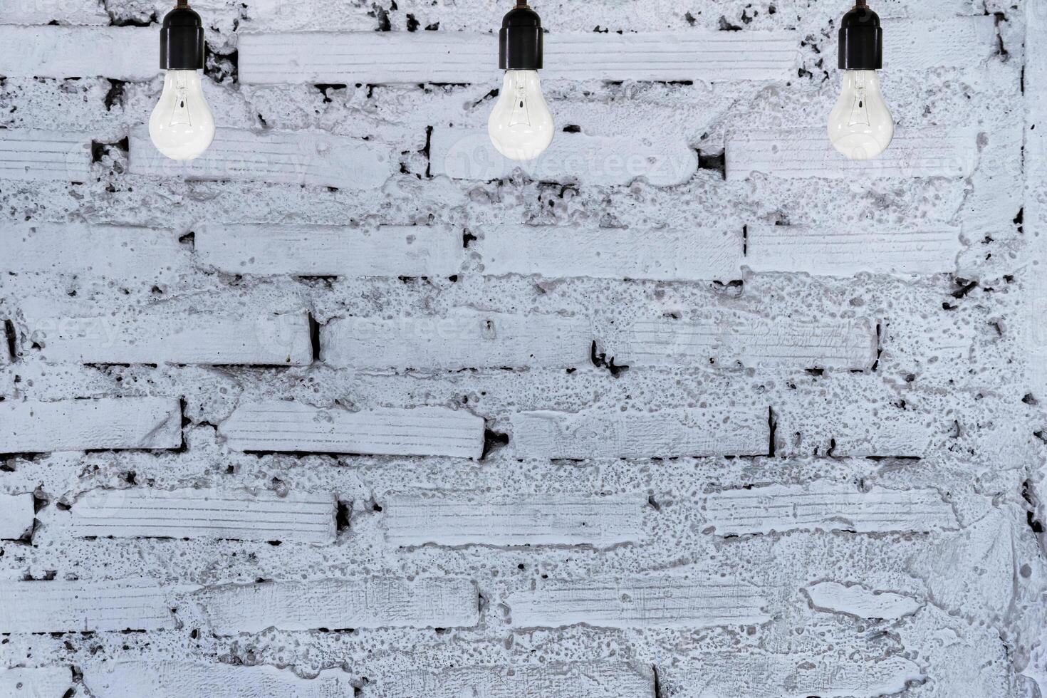 white brick wall, 3 bulbs photo