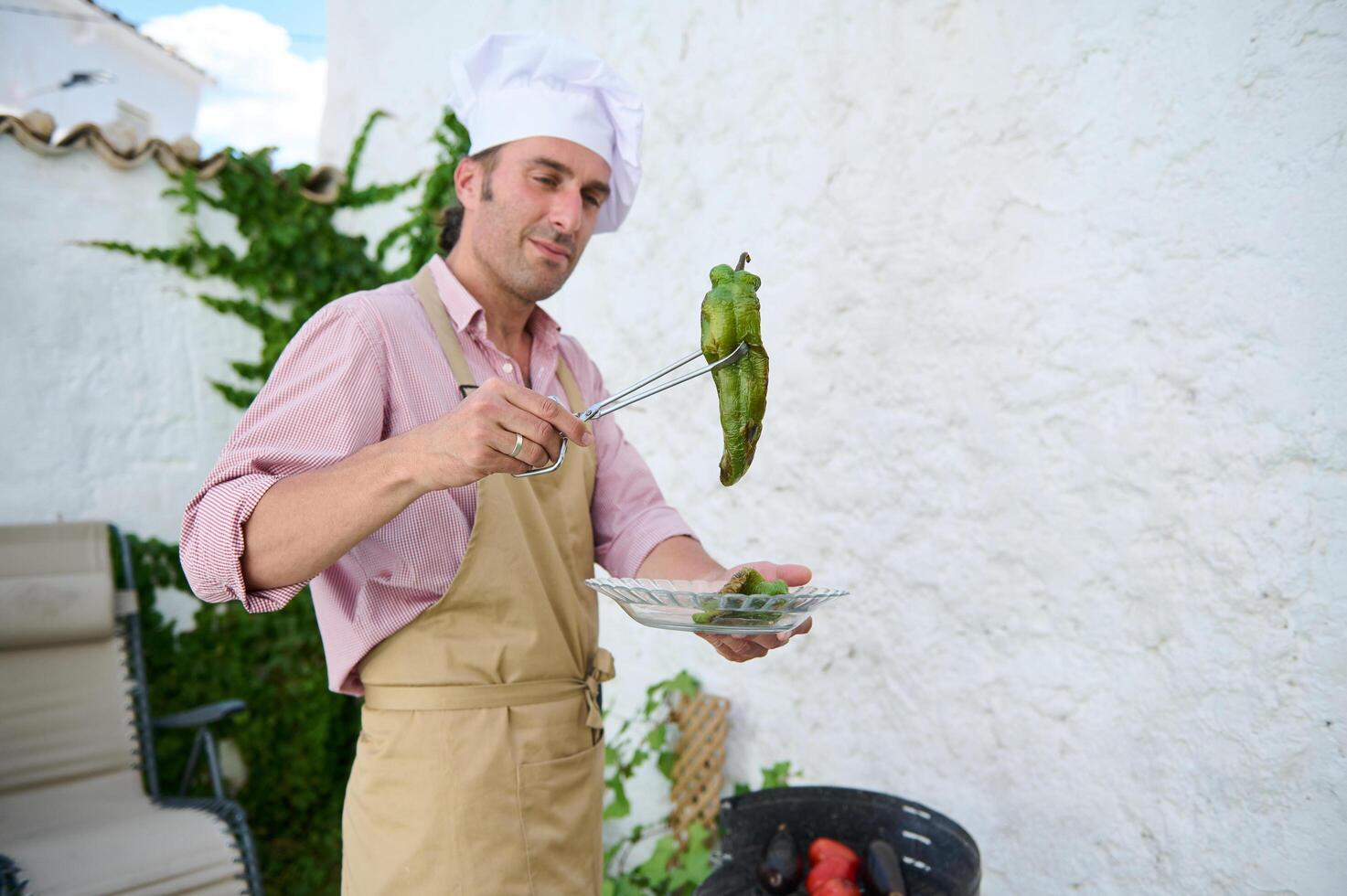 Chef grilling vegetables outdoors on a sunny day in a rustic setting photo