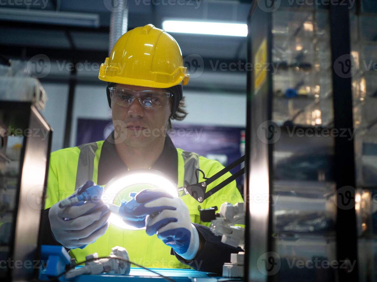 Male man yellow hardhat helmet safety engineer technician maintenance industry factory work job lamp repair production mechanic development tool innovation system research modern occupation equipment photo