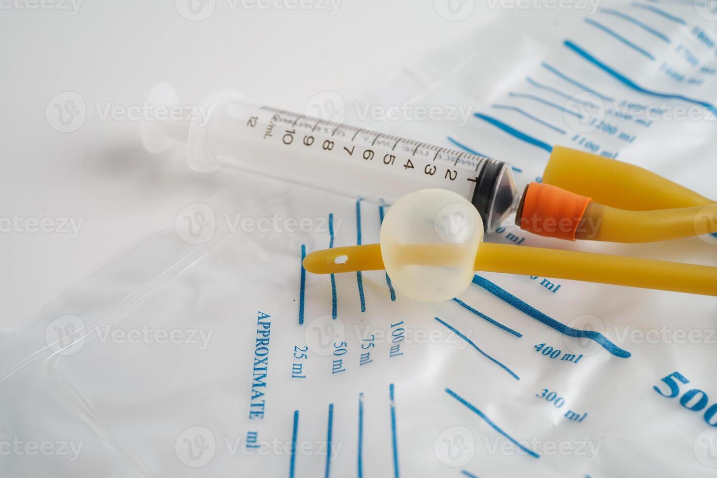 Foley catheter and urine drainage bag collect urine for disability or patient in hospital. photo