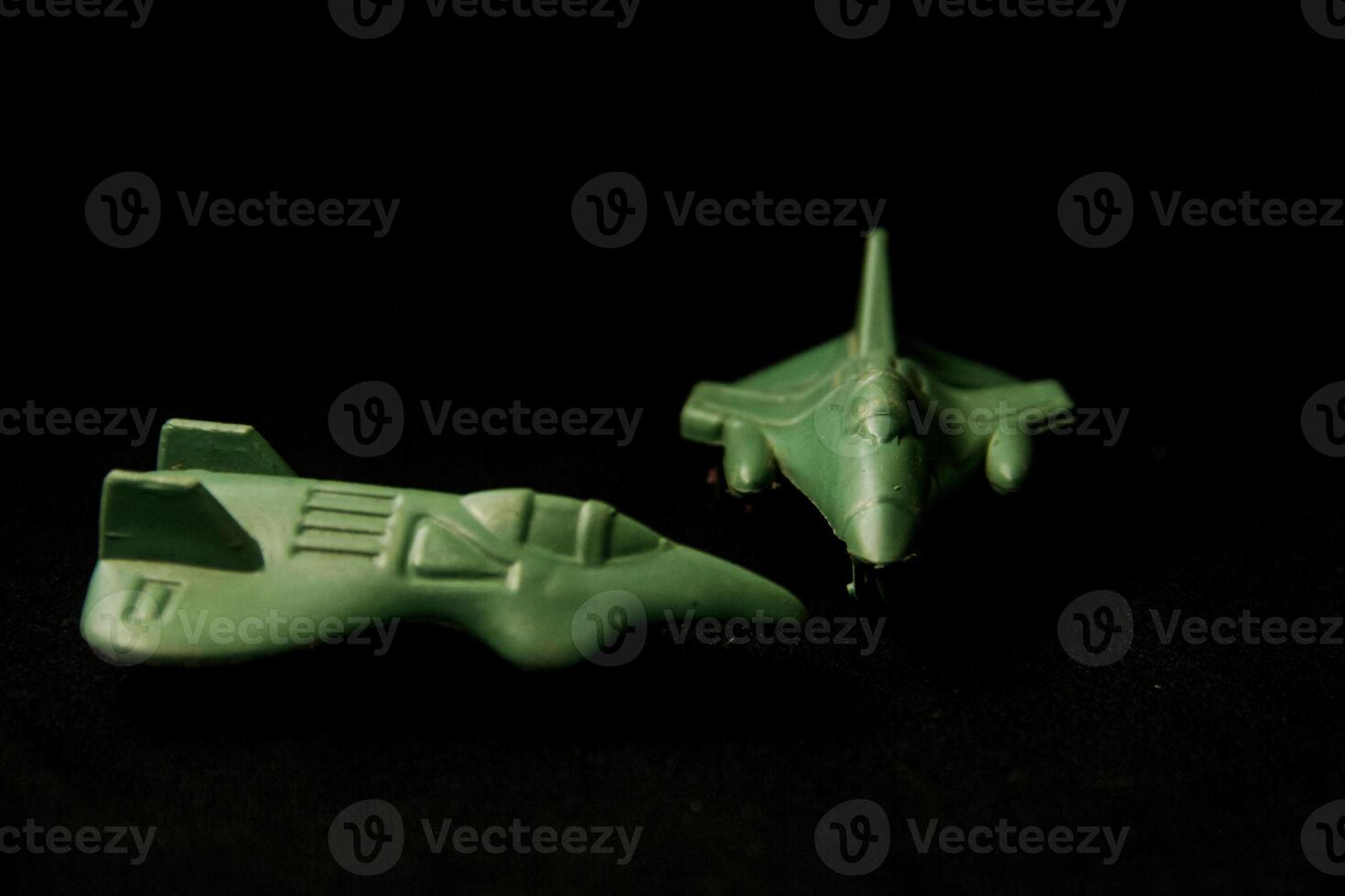 Miniature fighter plane made of plastic that depicts military power photo