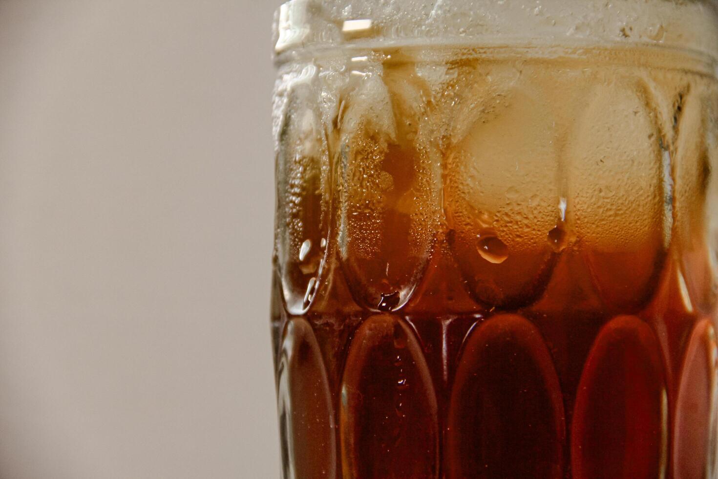 Fresh drink of cold tea, cold sweet iced tea in a glass photo