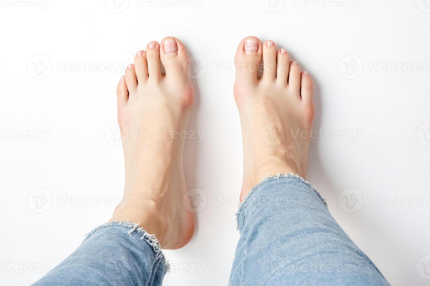 Barefoot woman in jeans photo