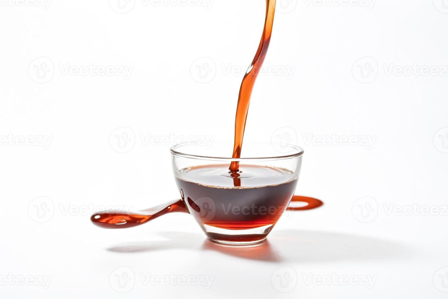 Pouring Perfection Amber Liquid into Glass Cup photo