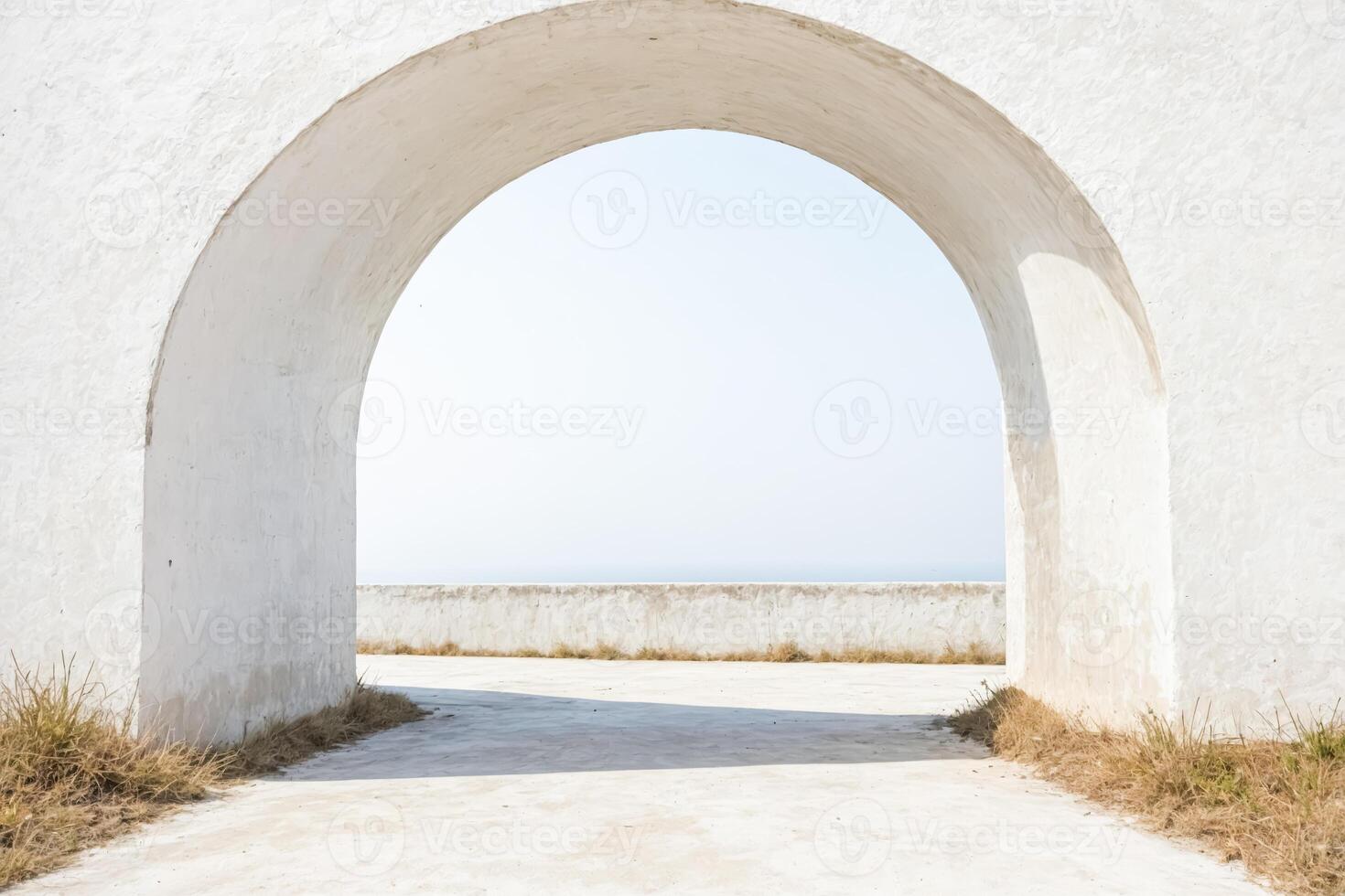 View of the Ocean Through a Stone Archway photo