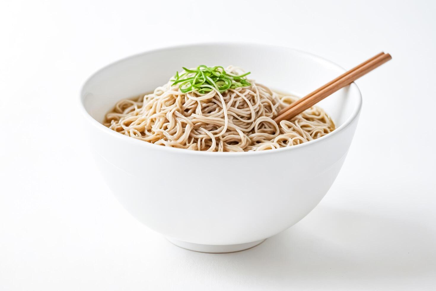 Close-up of soba noodles in a white bowl with chopsticks photo
