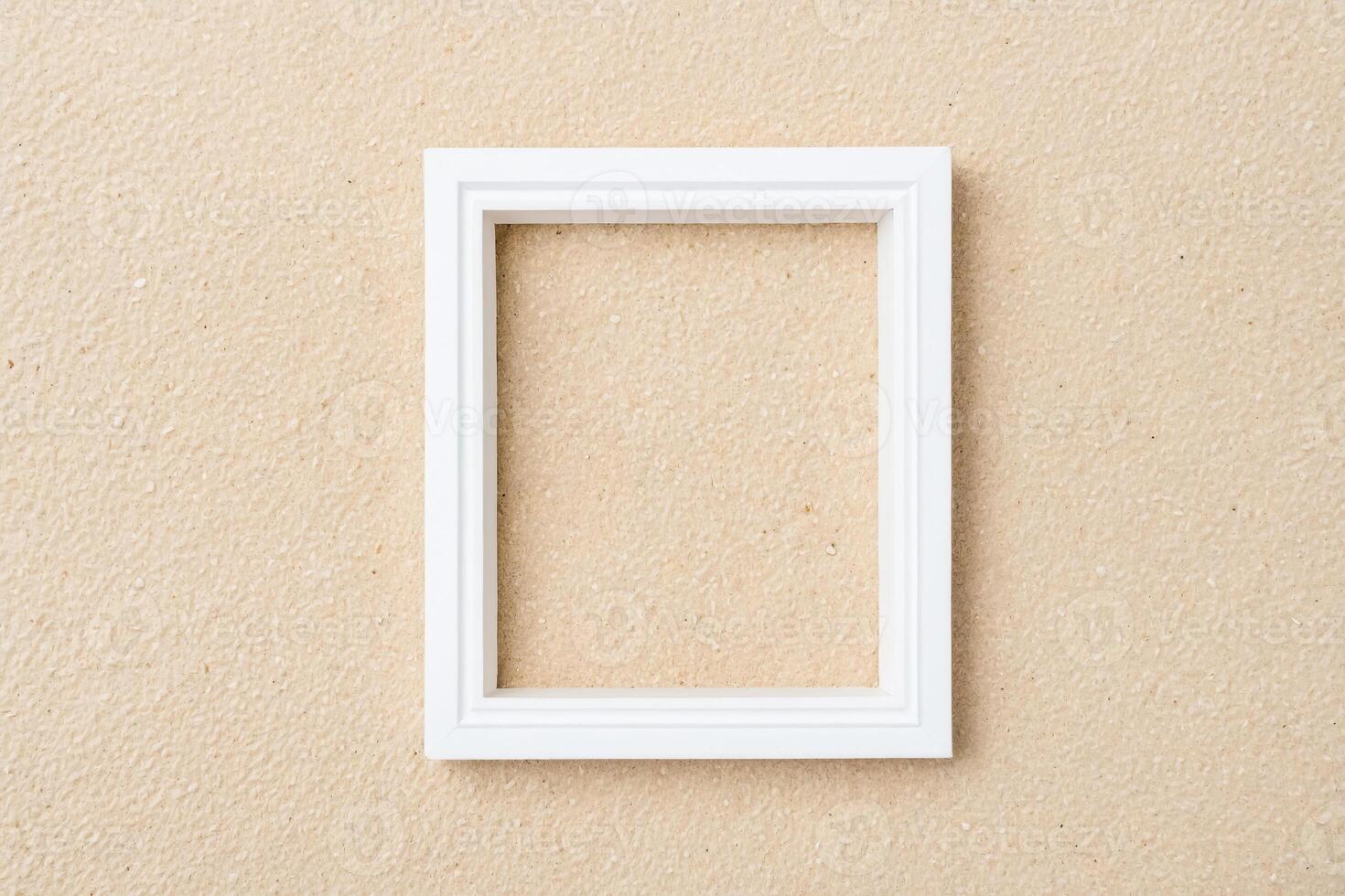 Blank White Frame on Beige Background photo