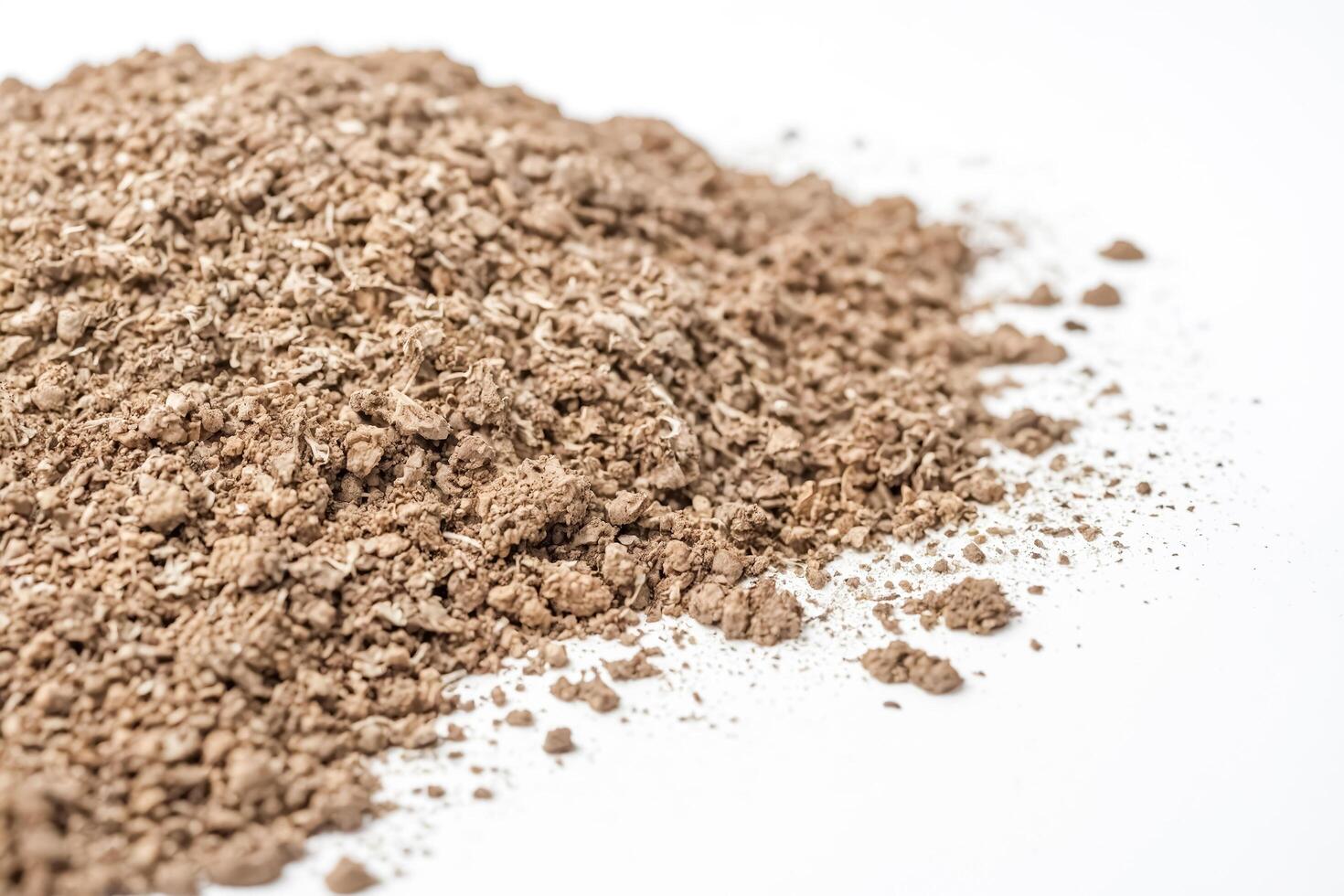 Close-Up of Brown Powder on White Background photo