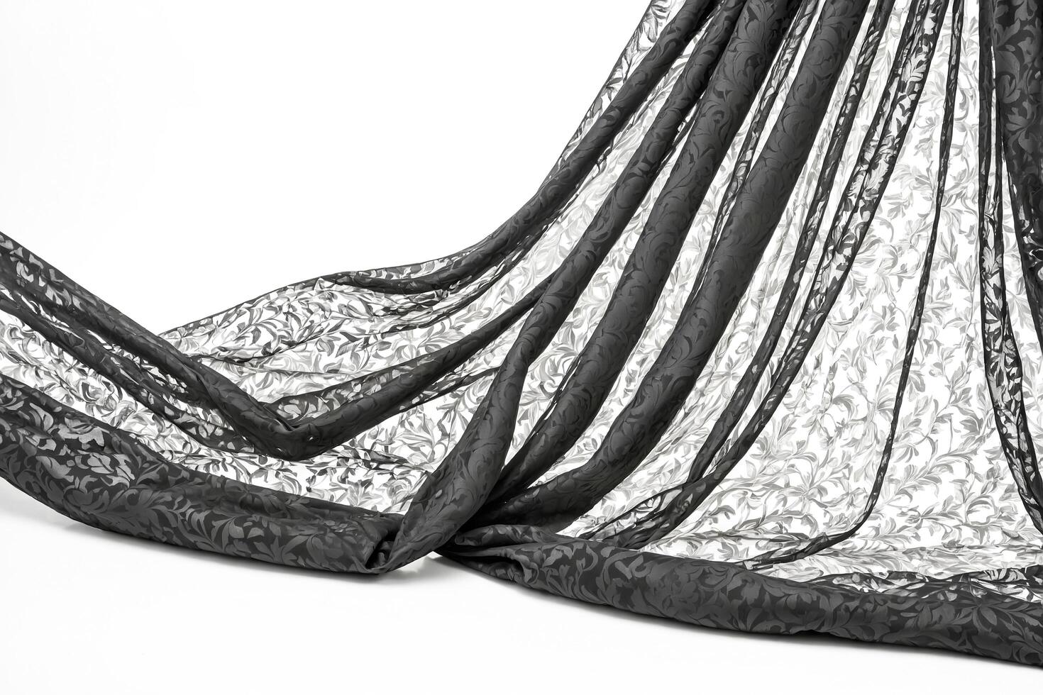 Black Floral Fabric Draped Over White Background photo
