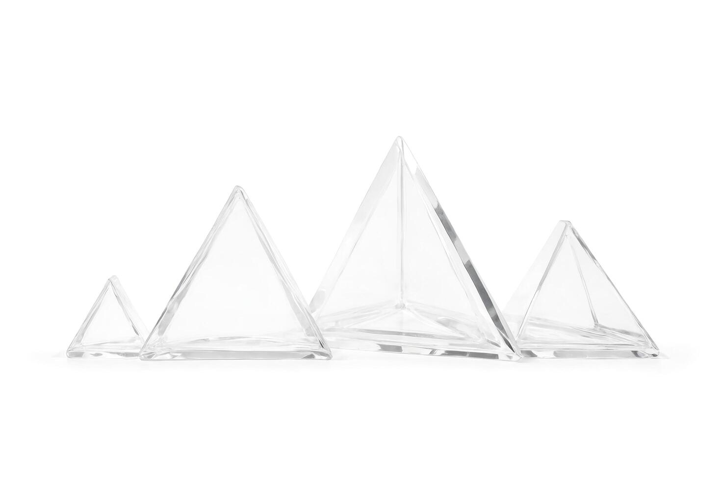 Glass pyramids of different sizes photo