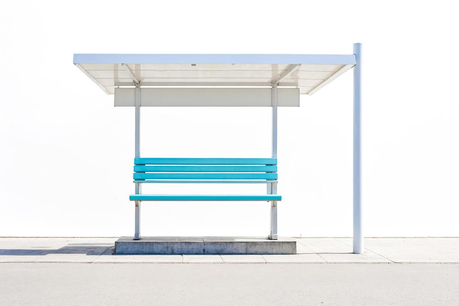 White Bus Stop Shelter with Blue Bench on White Background photo