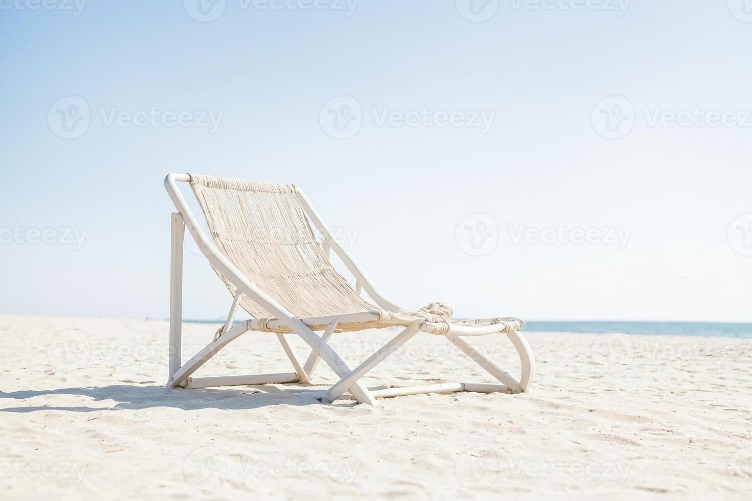 White Beach Chair on Sandy Beach photo