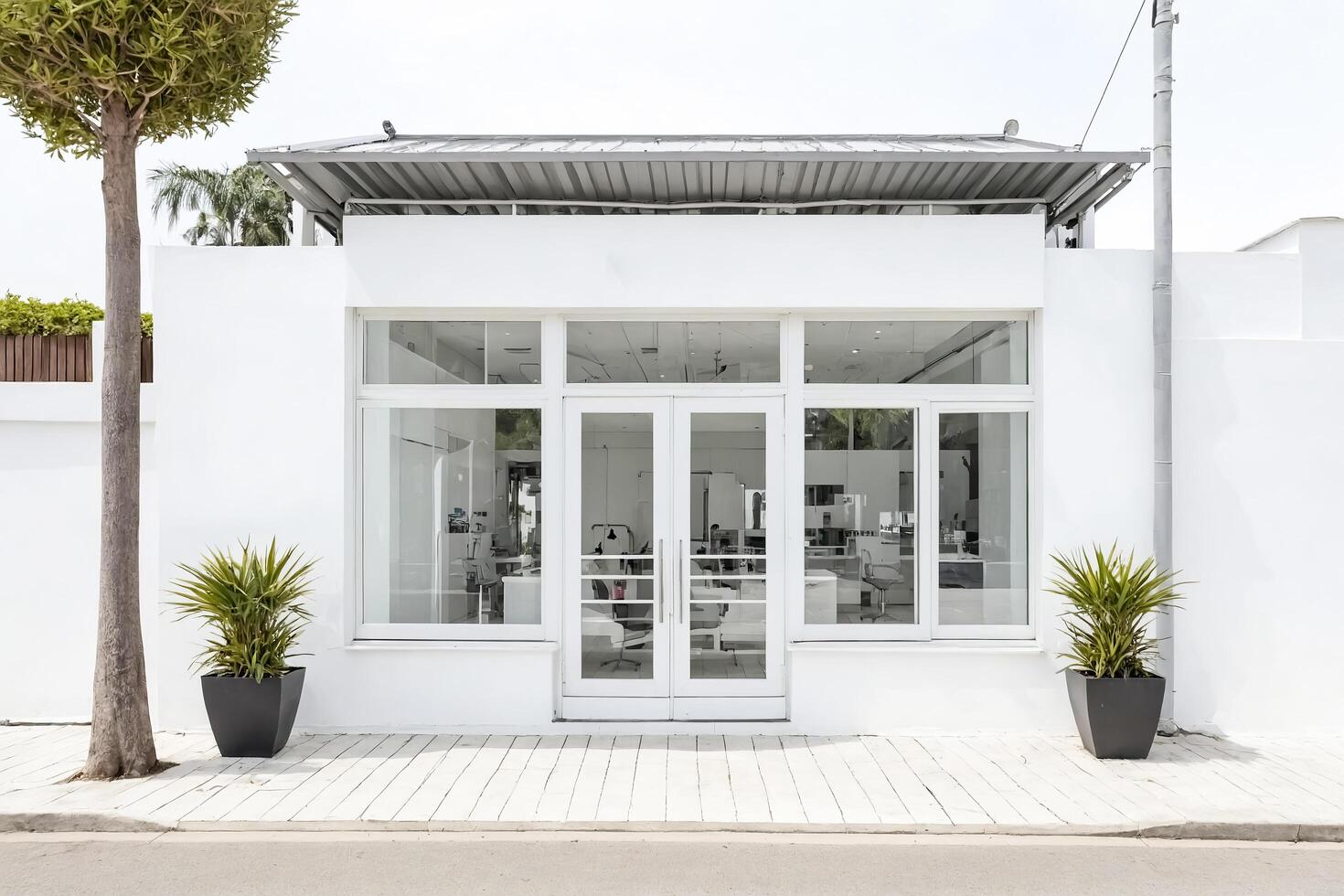 Minimalist White Storefront with Large Glass Windows and Doors photo
