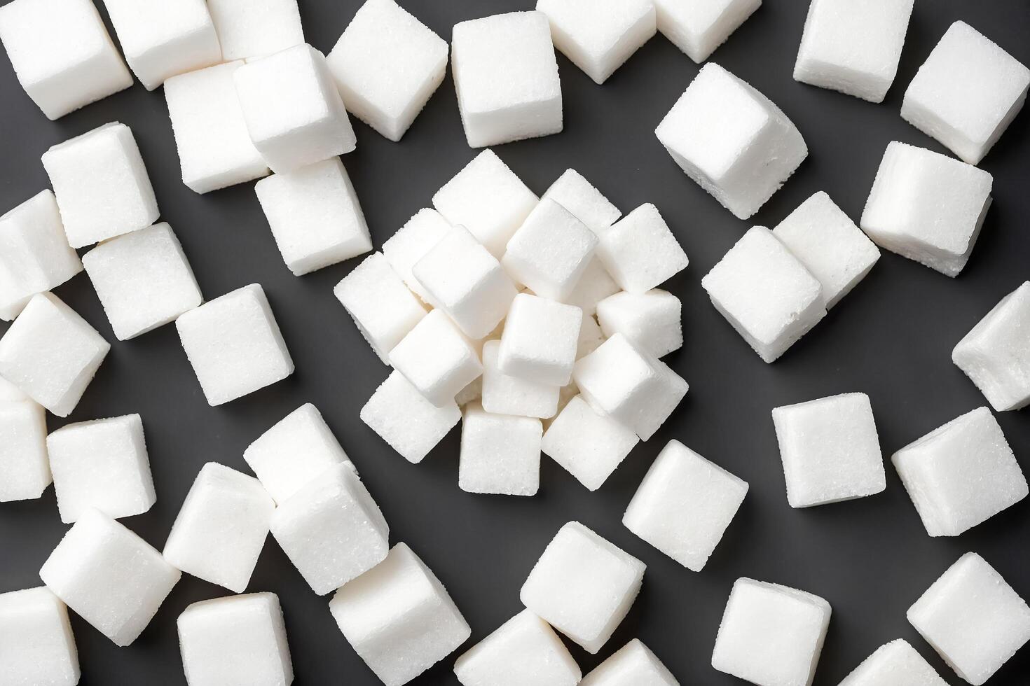 White Sugar Cubes On Black Background photo