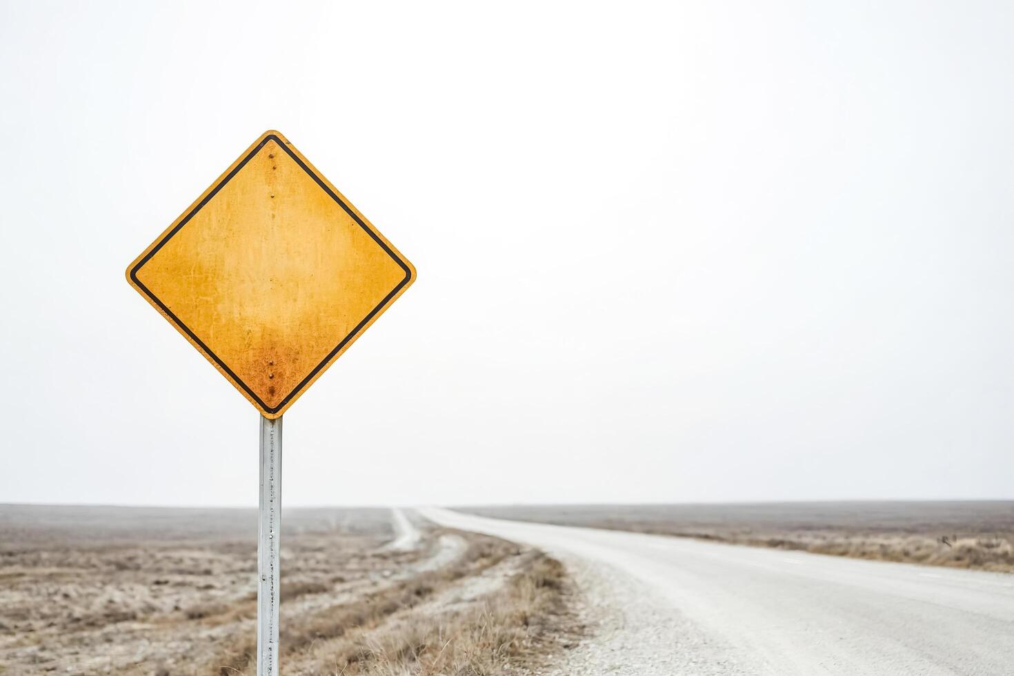 Blank Yellow Road Sign in the Countryside photo