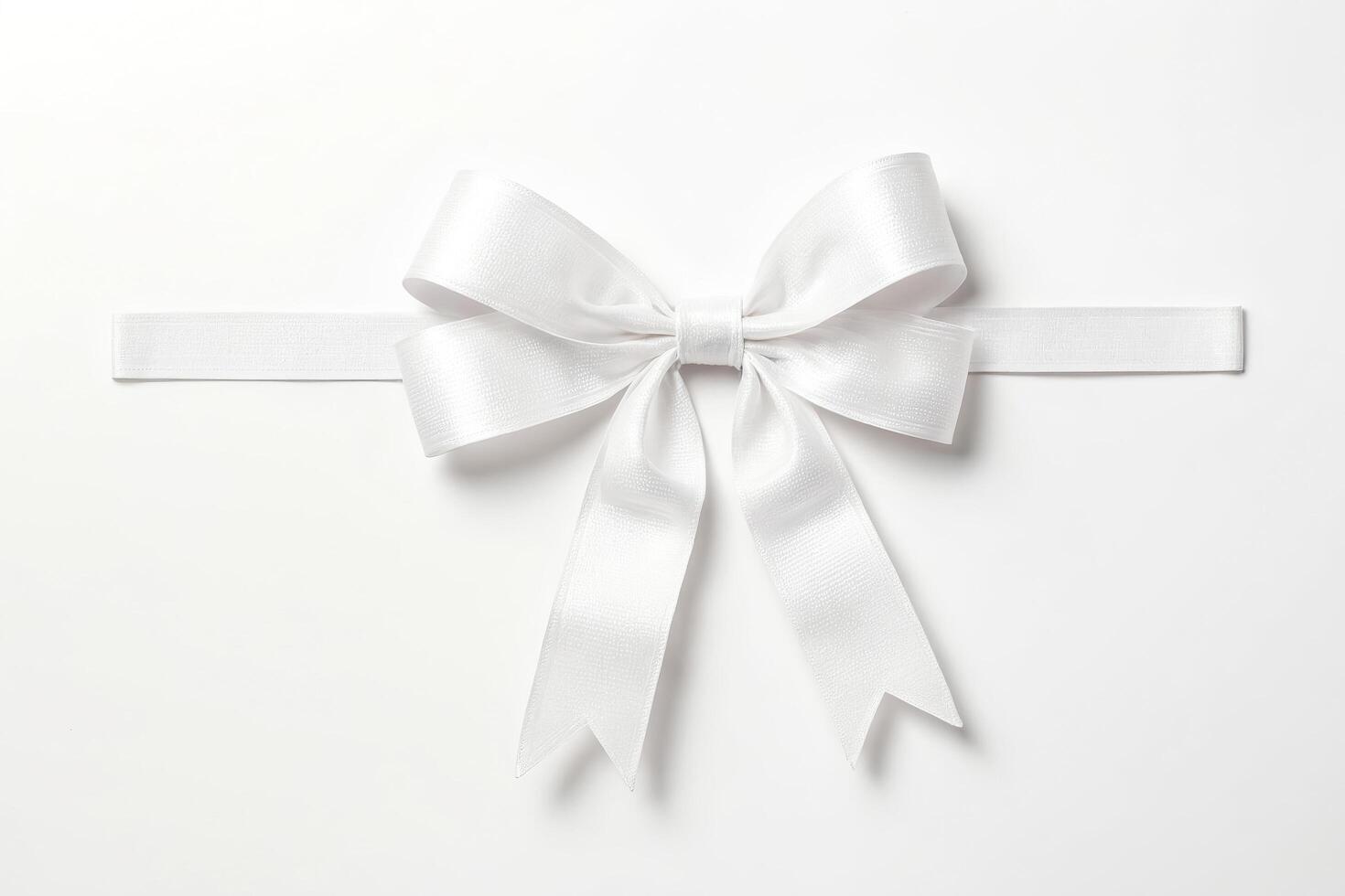 White satin bow isolated on white background photo