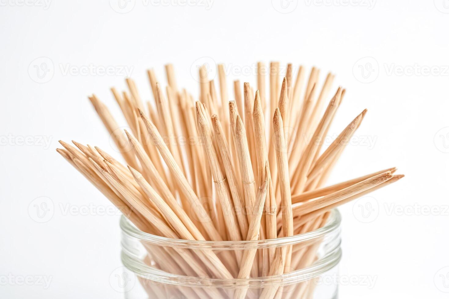 Close-up of wooden skewers in a glass jar photo