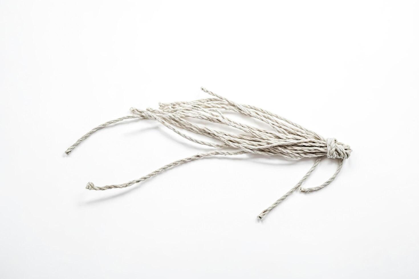 Closeup of a White Twine on a White Background photo