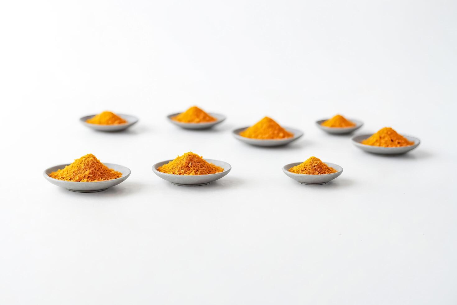 Yellow Powder In Bowls On White Background photo