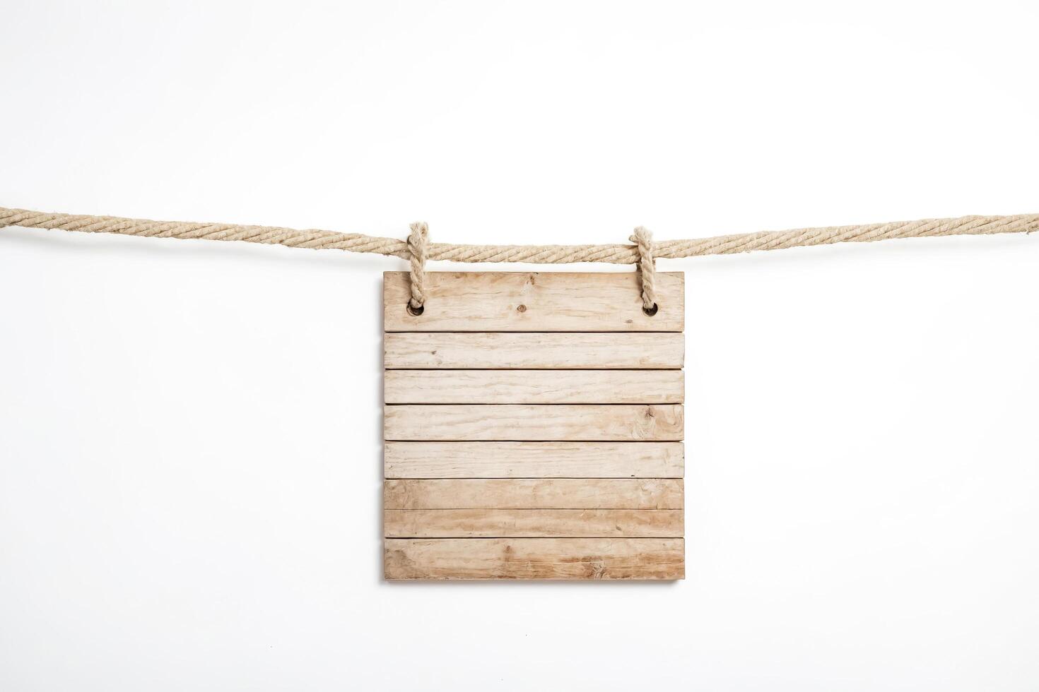 Blank Wooden Sign Hanging From Rope photo