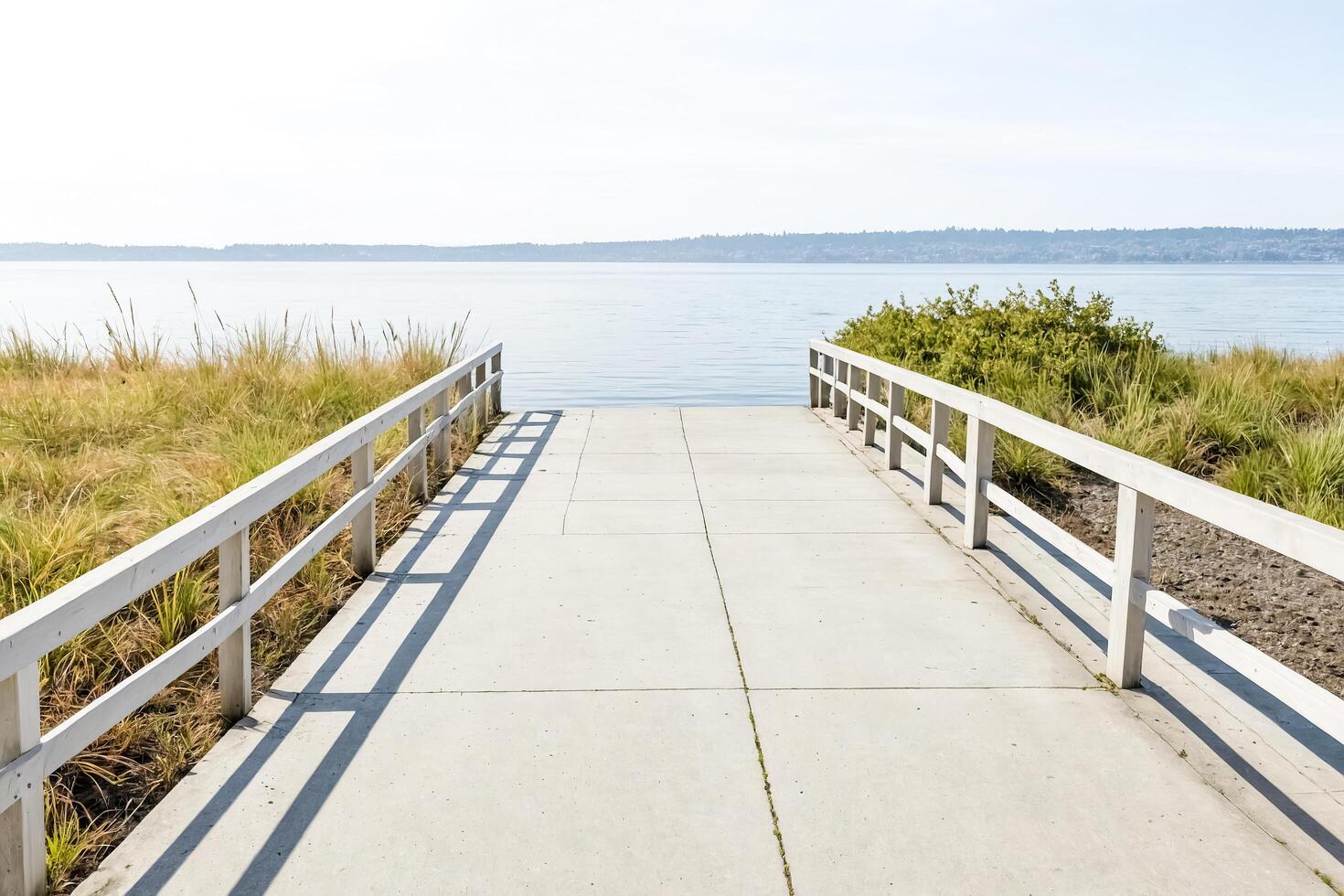 Concrete Pathway Leading to the Water photo