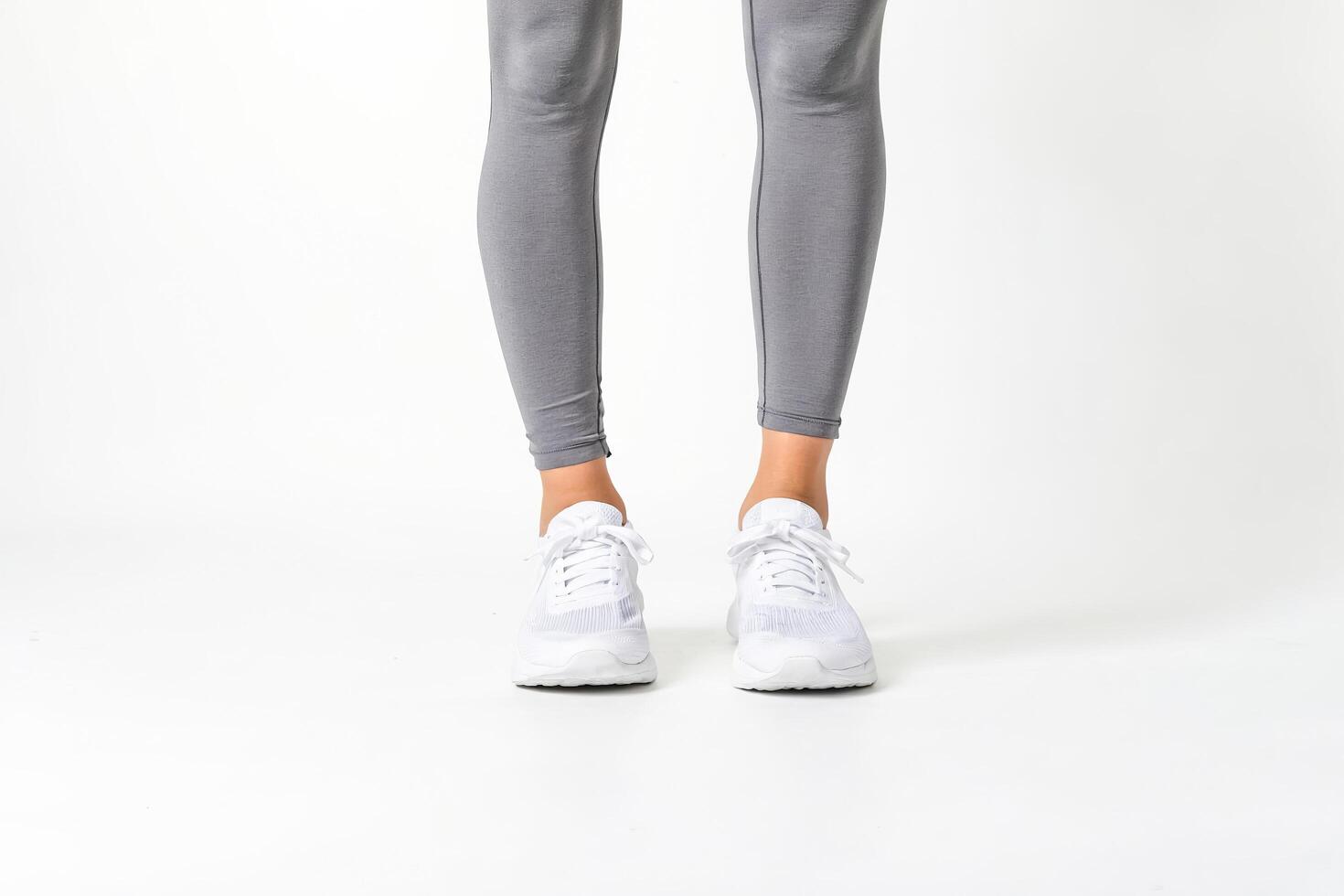 Woman in Gray Leggings and White Sneakers photo