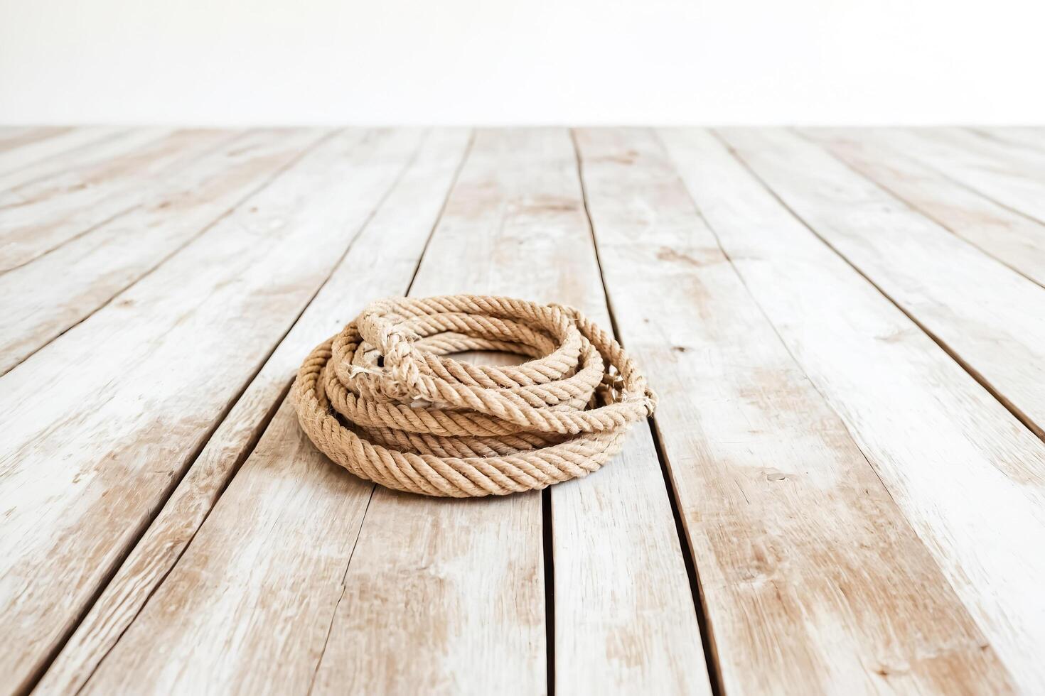 Nautical Rope on Rustic Wooden Background photo