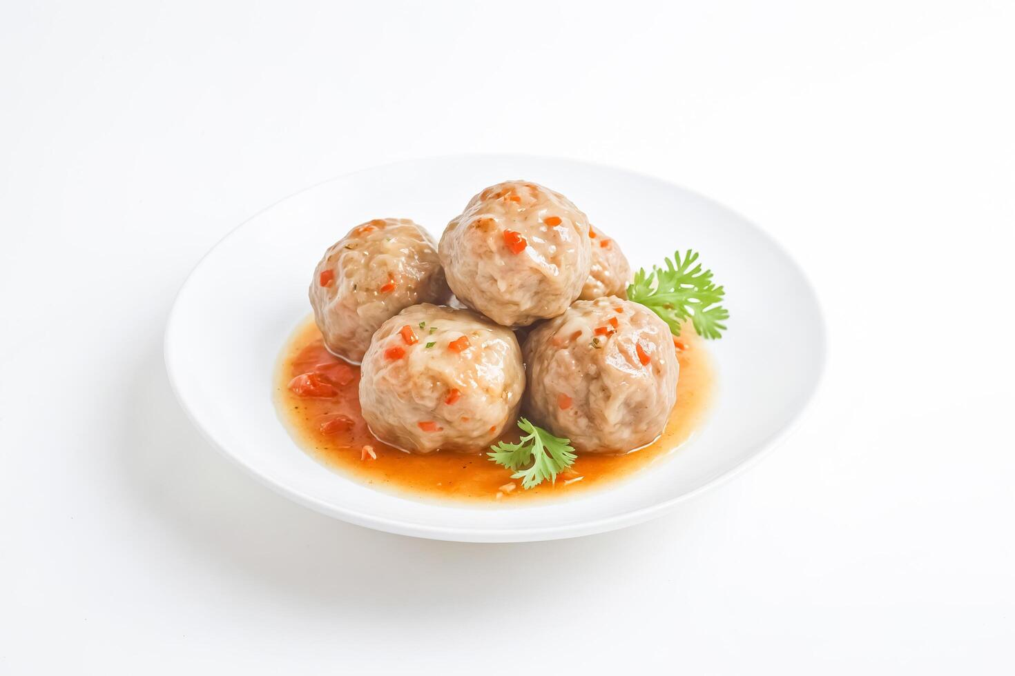Close-up of Chinese Pork Meatballs with Sweet and Sour Sauce photo
