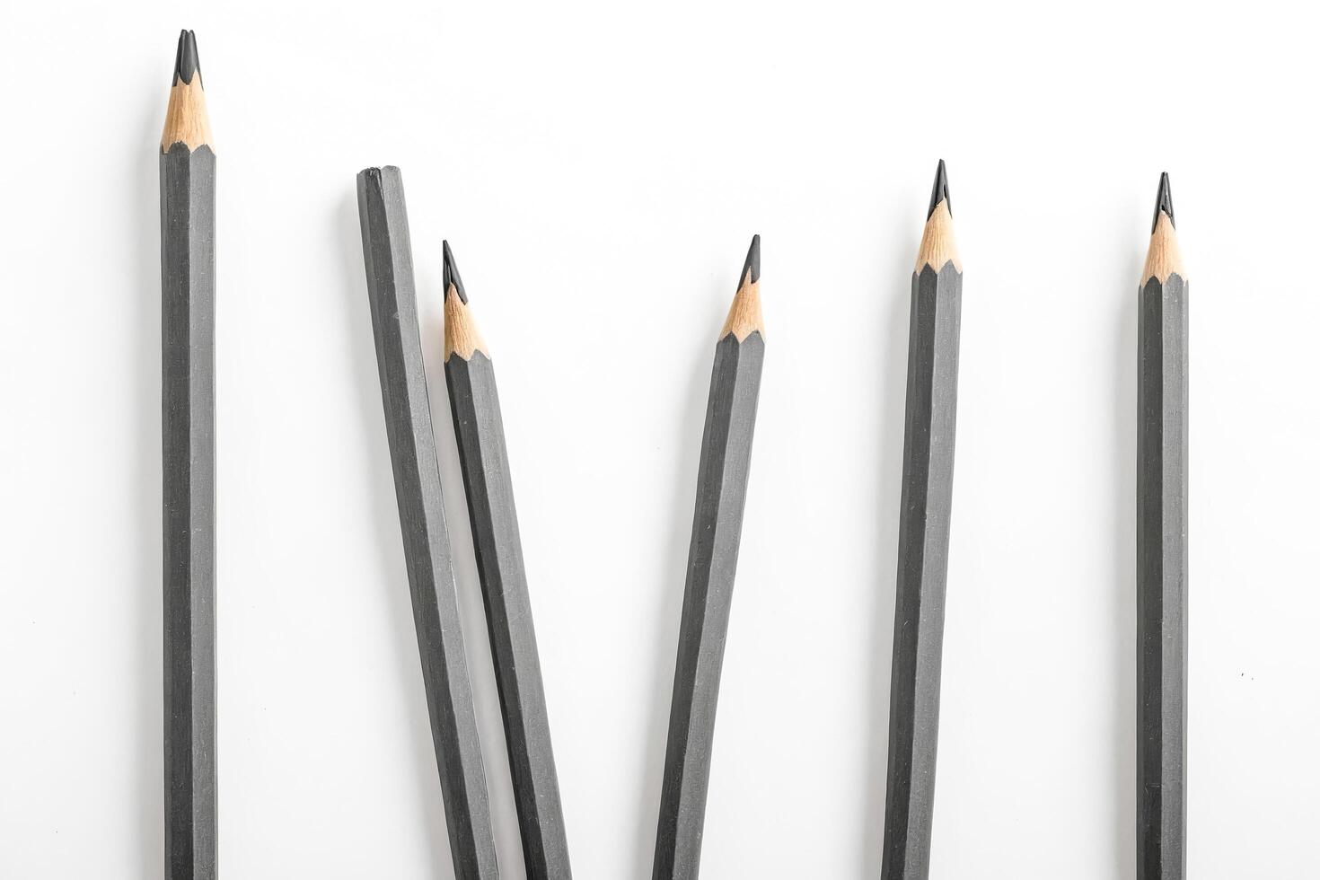 Six Graphite Pencils on White Background photo