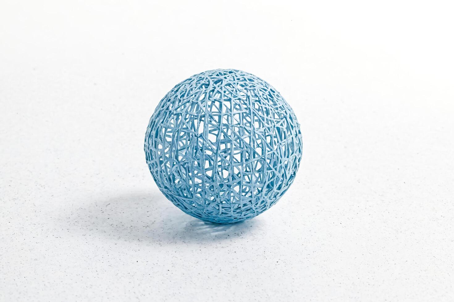 Blue Woven Sphere on White Background photo