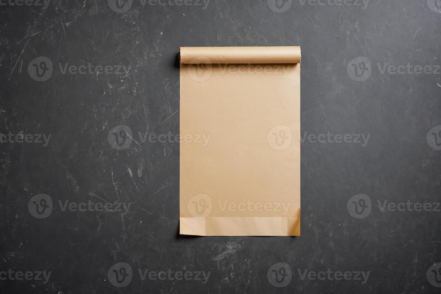 Blank Brown Paper Roll on Black Textured Background photo