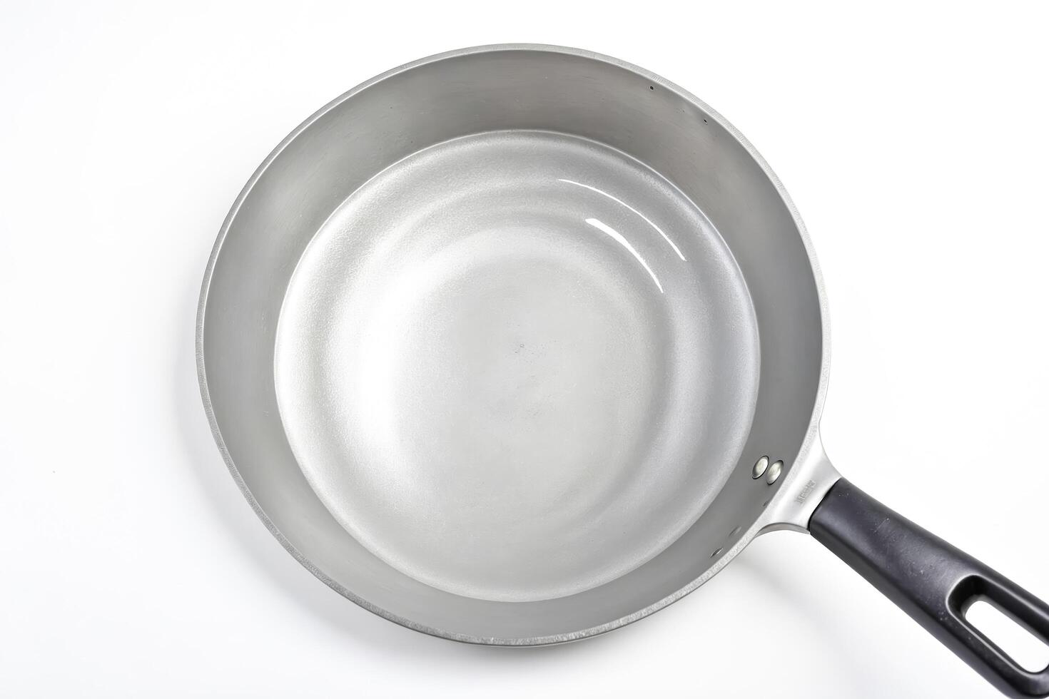 Empty Frying Pan Isolated On White Background photo