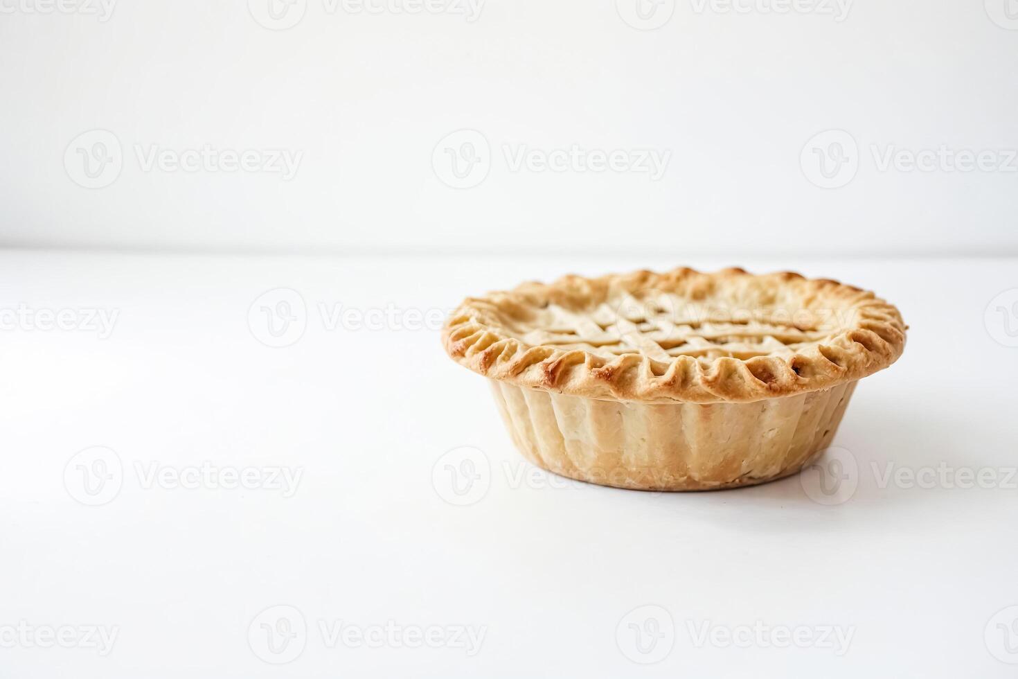 Close-up of a Baked Pie Crust on a White Background photo