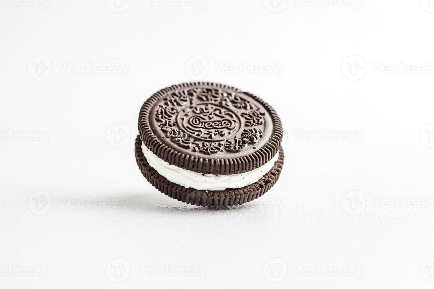 Chocolate Cookie with Vanilla Cream Filling on White Background photo