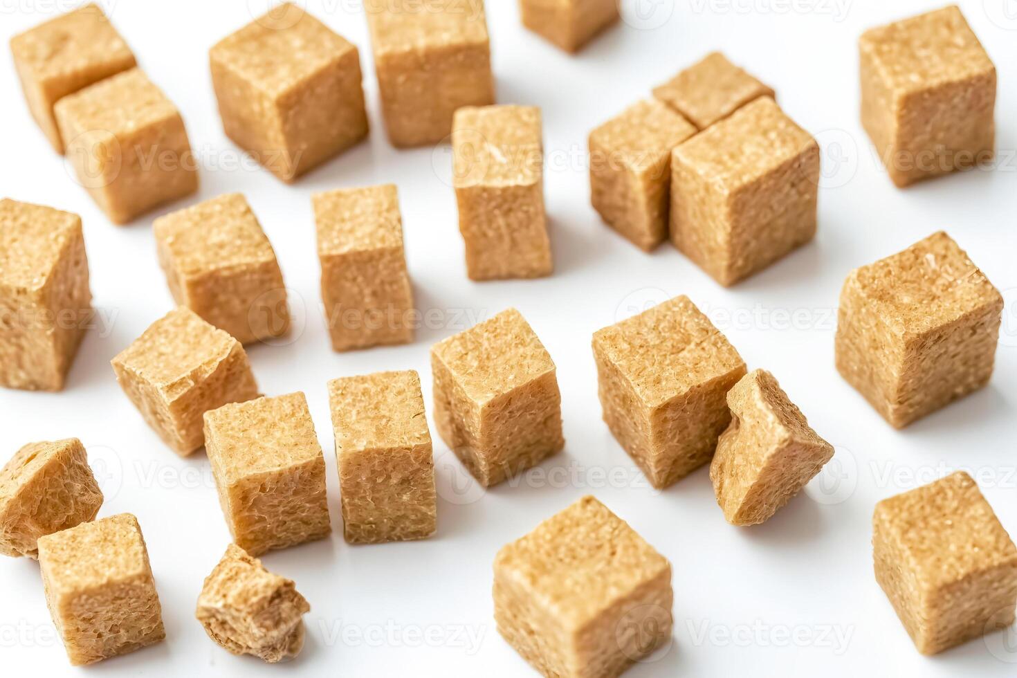 Close-up of Brown Sugar Cubes on White Background photo