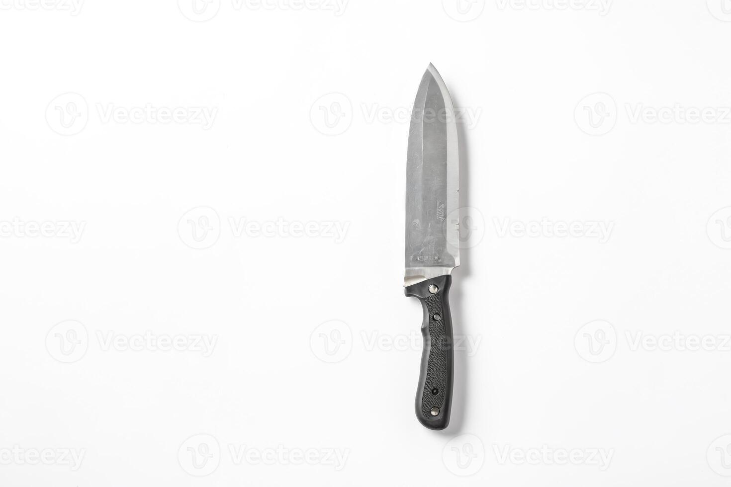 A knife with a reverse blade on a white background. photo