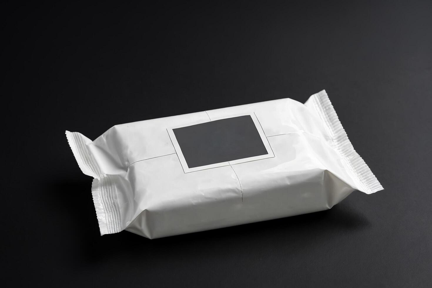 White Package with Black Label on Black Background photo
