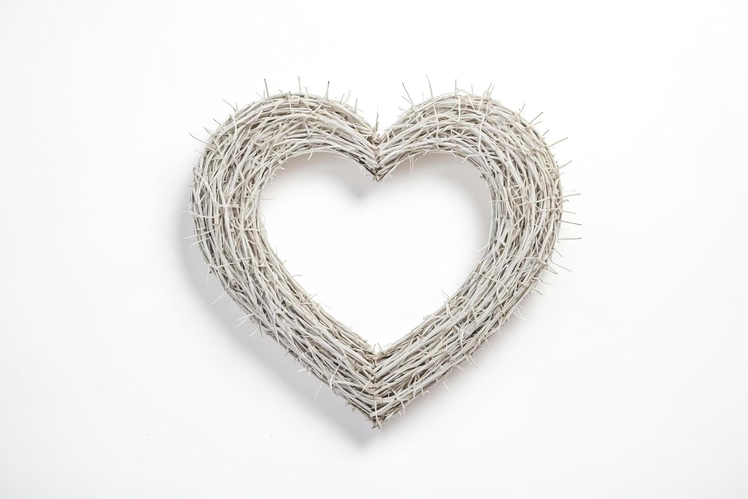 White heart-shaped wreath on white background photo