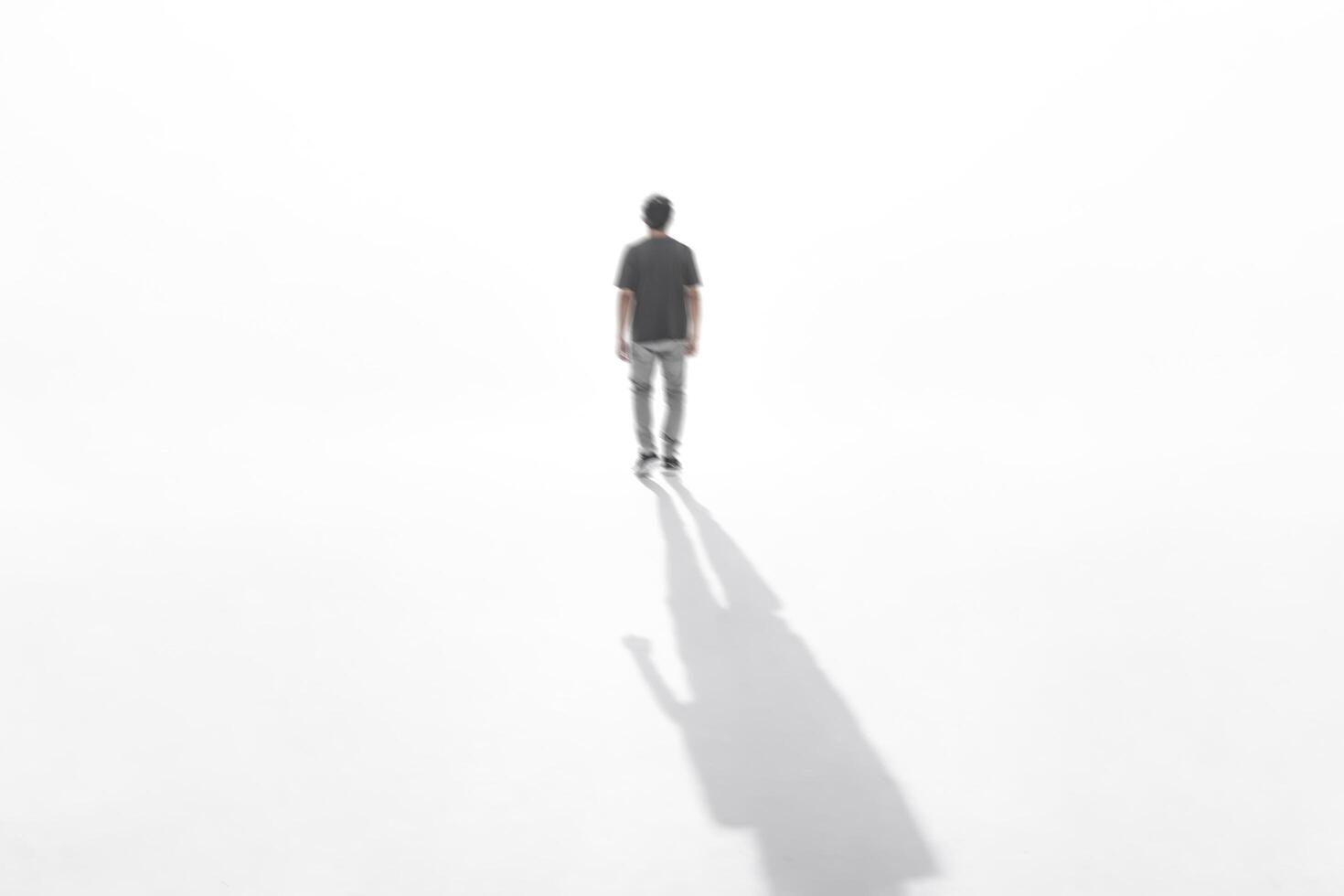 Blurred Silhouette of a Man Walking Away photo