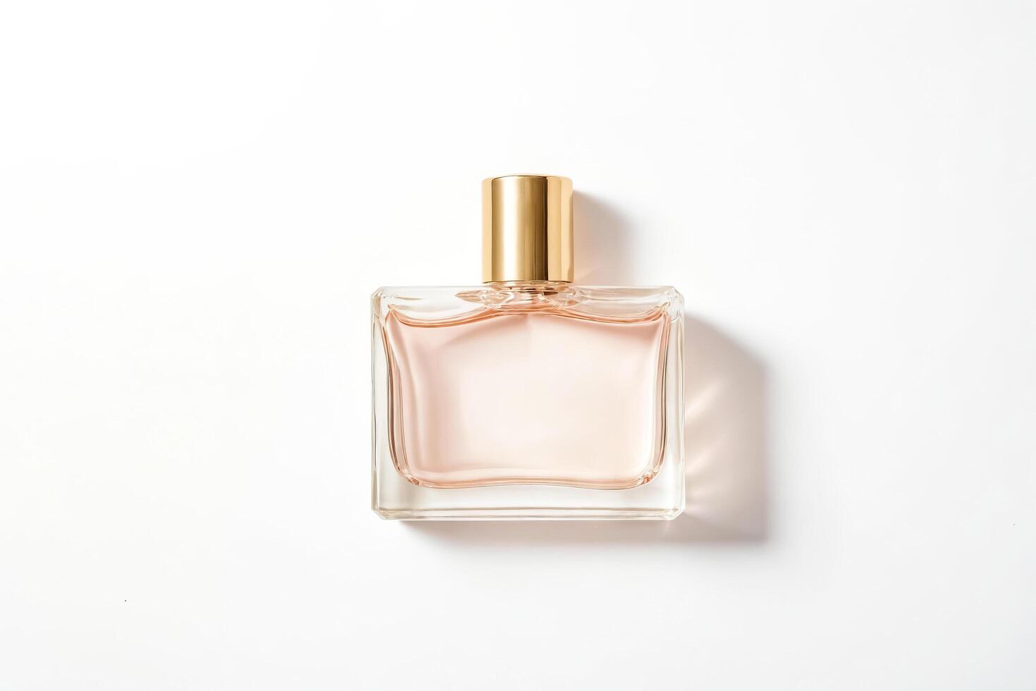 Glass Bottle of Perfume on White Background photo